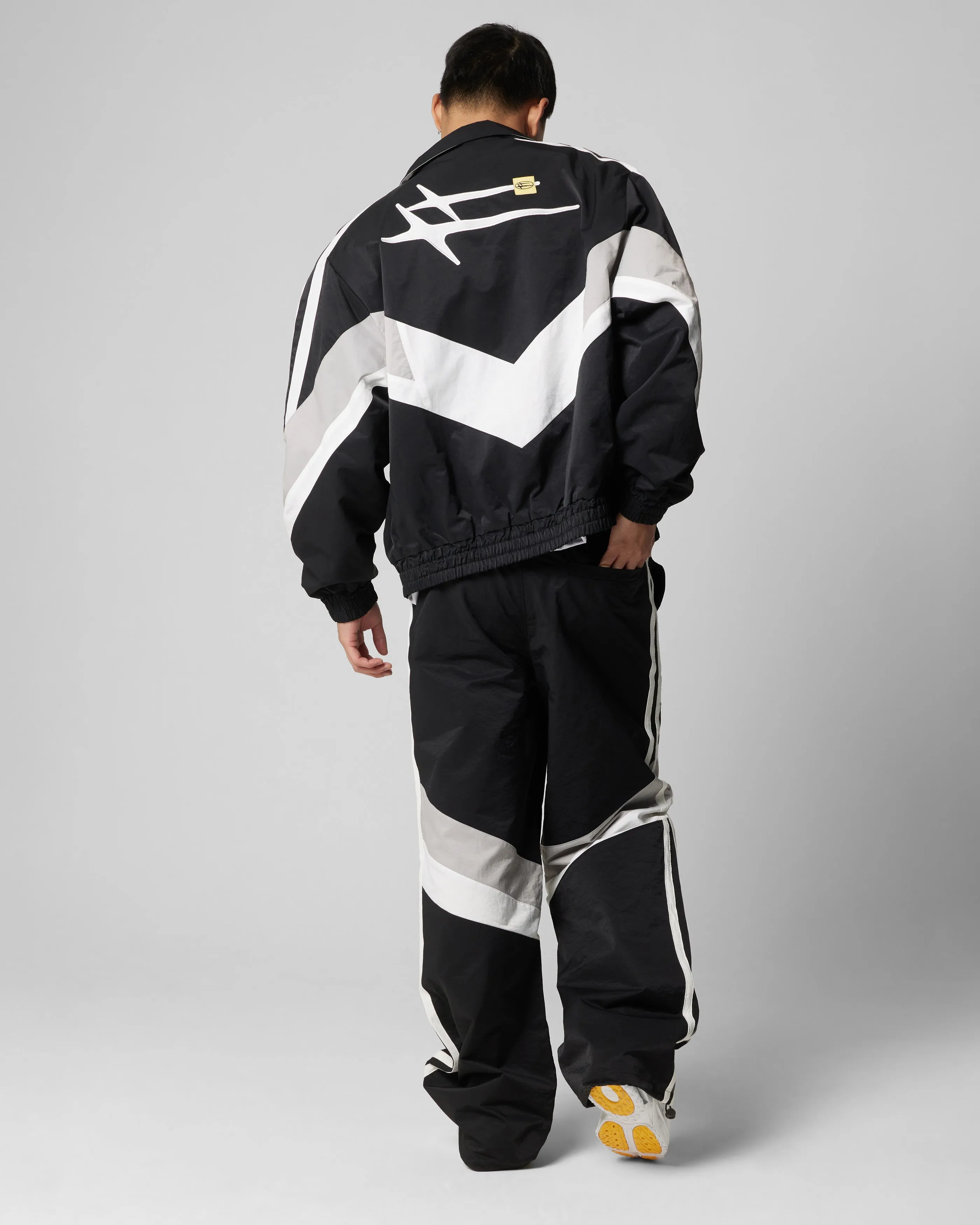 Loiter Hybrid Track Jacket Black/Grey suitable for work commutes